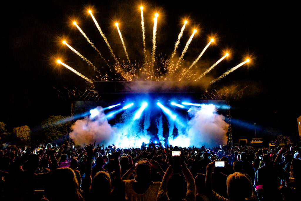 dj,concert,festival,with,special,effects,fireworks,over,the,silhouette