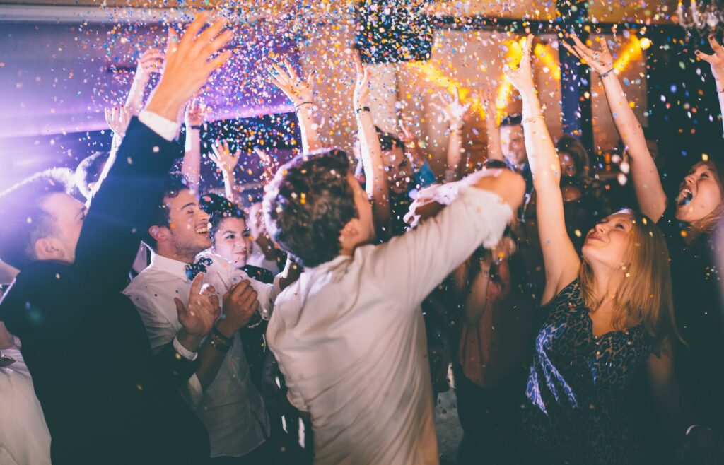 group of hipsters throwing confetti at a party in royalty free image 469322890 1544723127 copy